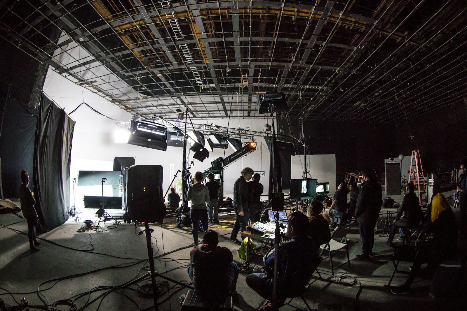 A film crew working on a large sound stage